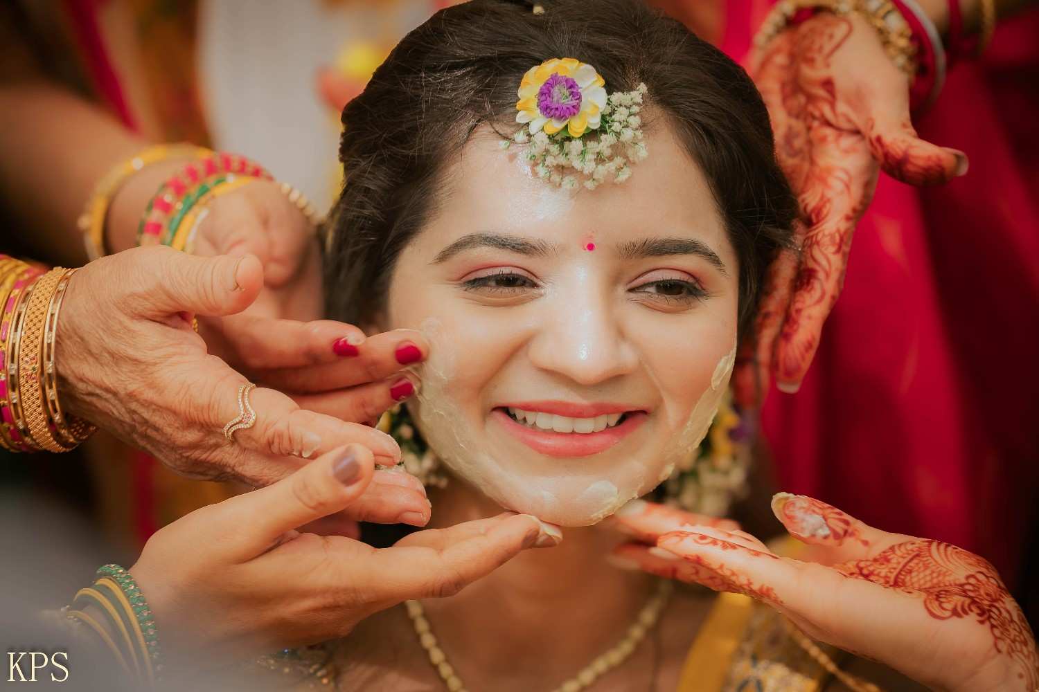 Beautiful Indian wedding couple during ceremony with flower petals